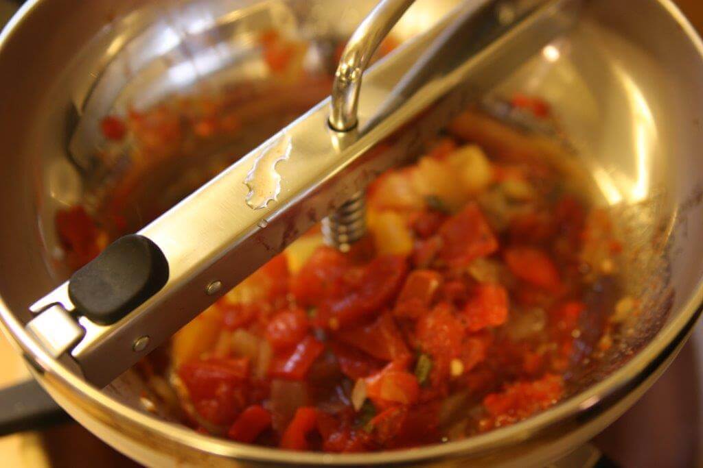 A food mill on the "coarse" setting will provide the best consistency for your finished salsa.